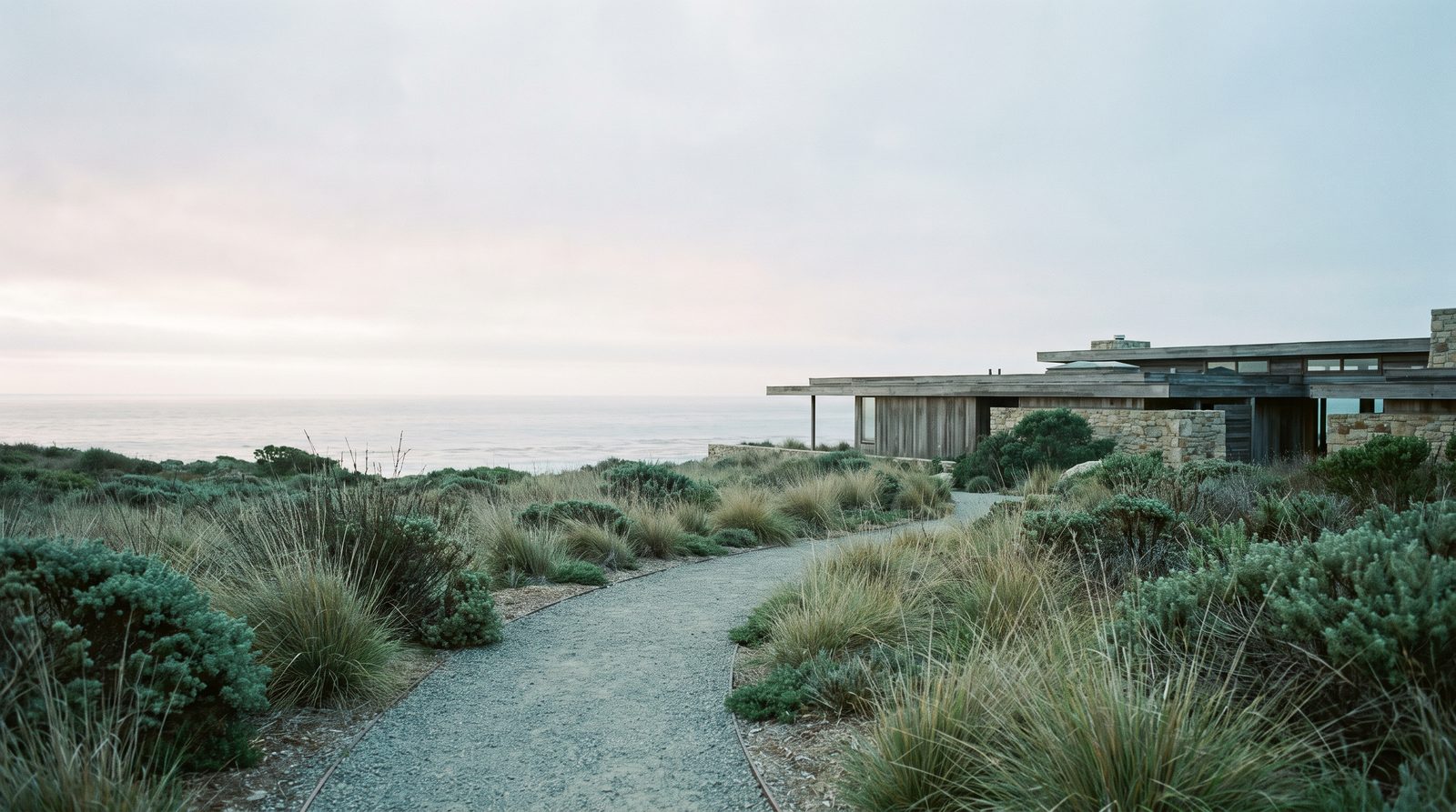 Quiet landscaped path connecting a care setting with the surrounding coast